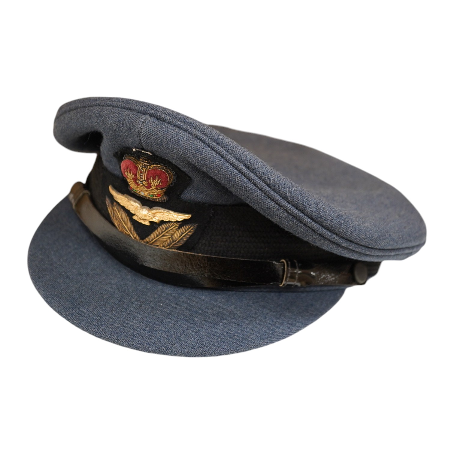 Two post-WWII RAF uniforms, one with applied medal ribbons, an RAF cap, and related buttons, together with a bowler hat and two Arab daggers. Condition - good